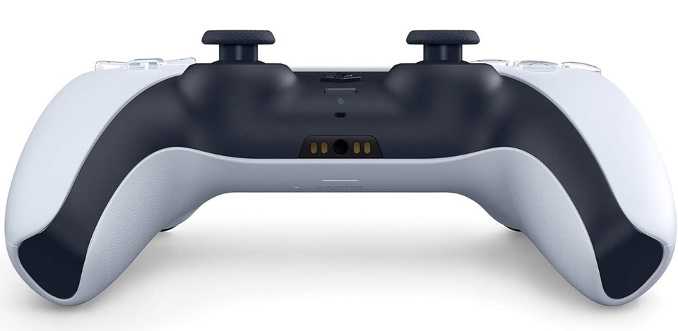 Bottom‑side view of a PlayStation 5 DualSense wireless controller showing the underside of the two‑tone black and white body, the grips extending downwards, the small speaker/mic vents, and the textured surface without the buttons visible from the top.