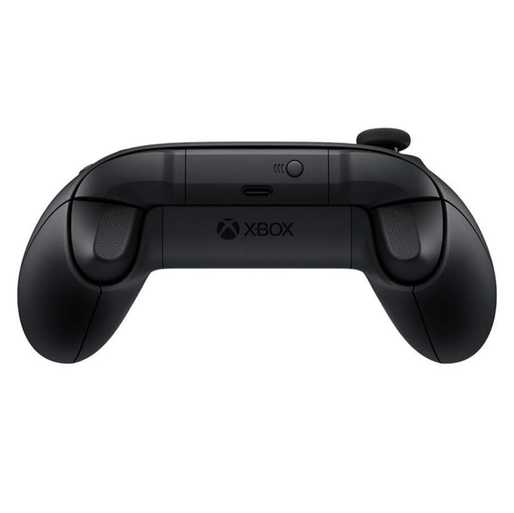 Close-up rear view of a black Xbox Wireless Controller showing the underside and top edge. Visible are the left and right analogue triggers and shoulder bumpers with textured surfaces, curved ergonomic grips for the palms, the Xbox logo printed on the battery compartment cover, and the wireless pairing button and USB-C port on the top centre. The matte black plastic finish and subtle contours of the triggers are also visible.