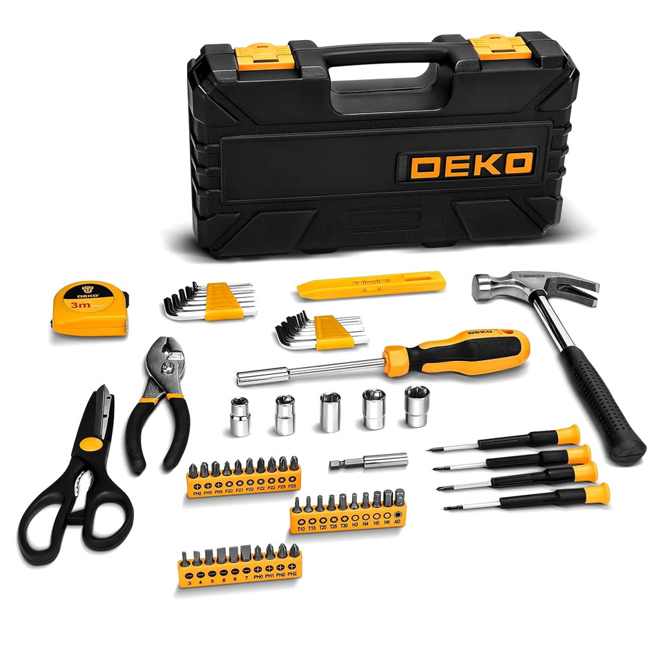 Black and yellow DEKO 62-piece home repair DIY tool kit with a compact black plastic storage case. Tools displayed include a claw hammer, tape measure, pliers, utility scissors, multiple screwdrivers, hex keys, assorted screwdriver bits and sockets, and a handled bit driver laid out in front of the case for easy viewing.
