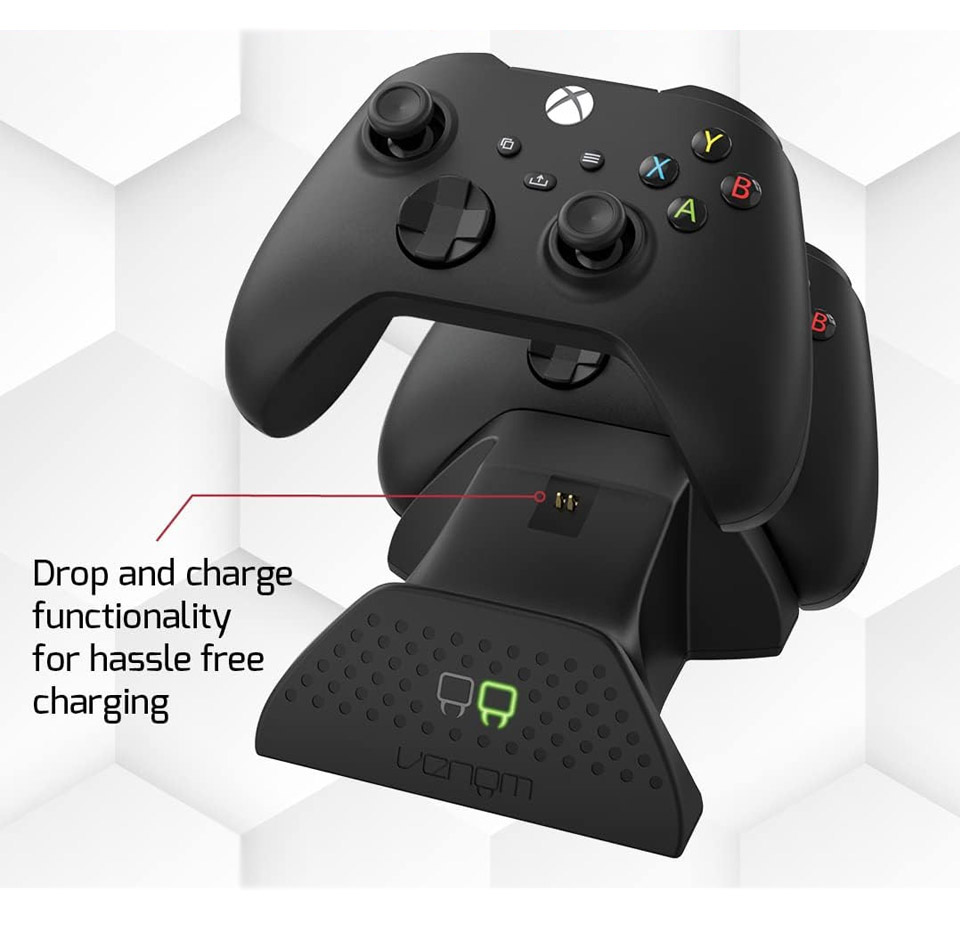 Black Venom twin charging dock holding two Xbox wireless controllers, showing the green front LED charge indicator and a sleek drop‑and‑charge cradle design for hassle free charging of Xbox controllers.