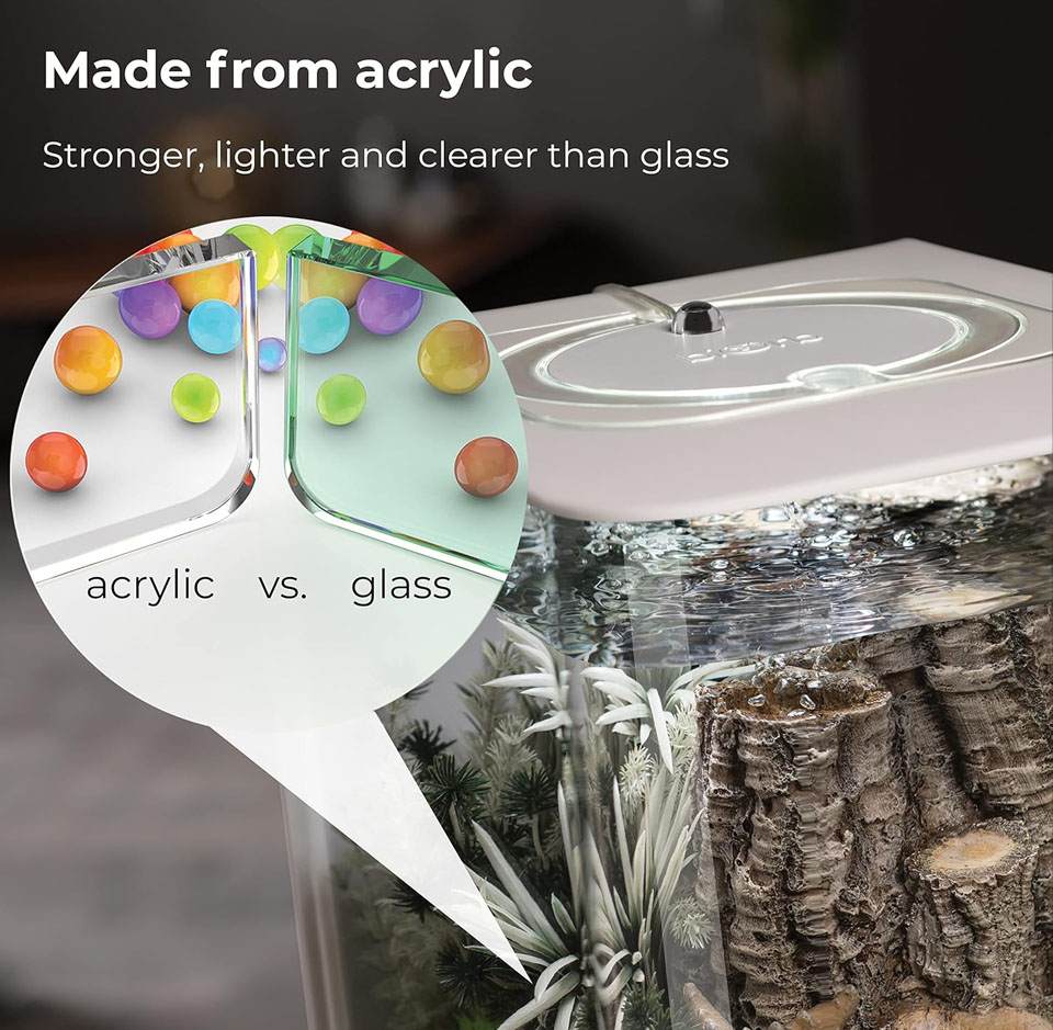 A close-up of a biOrb FLOW 30 LED aquarium corner showing clear acrylic walls and the top LED light unit, with a graphic callout reading ‘Made from acrylic - stronger, lighter and clearer than glass’ emphasizing the tank’s transparent acrylic construction.