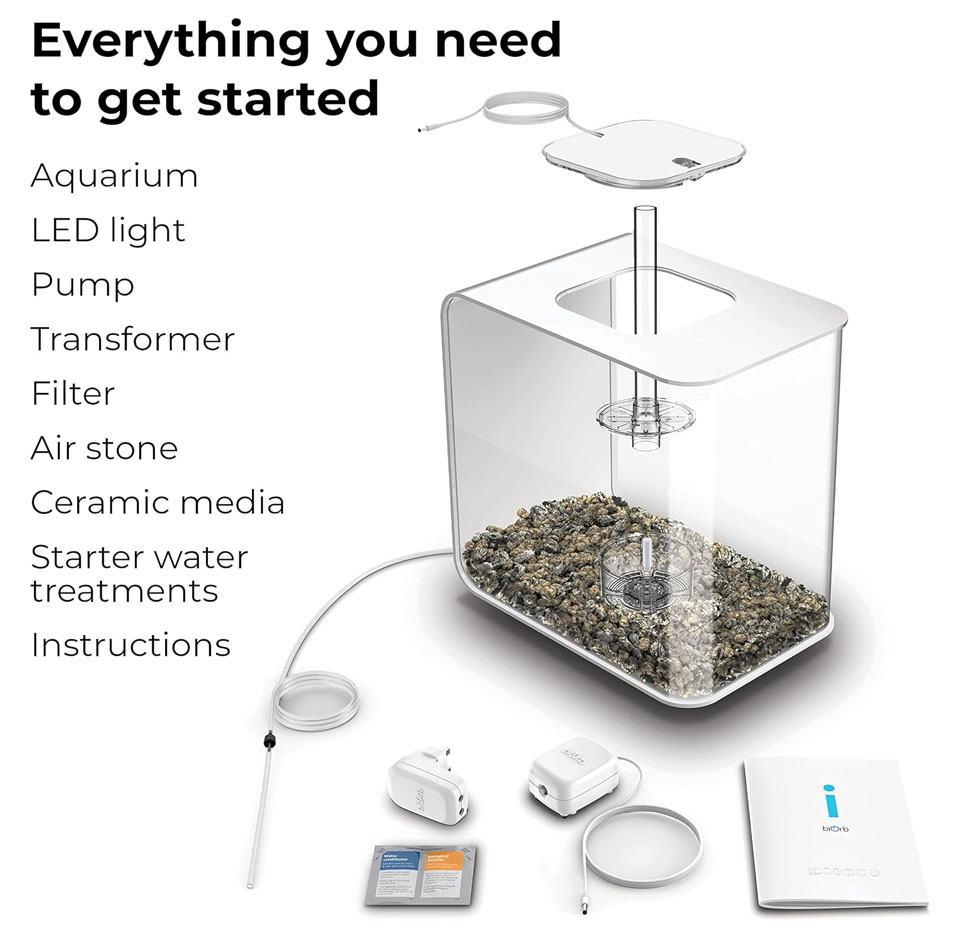 Clear acrylic biOrb FLOW 30 LED aquarium kit with removable top, internal filtration components, air pump tubing, LED light unit, transformer, ceramic media, and instructions arranged on a white background.